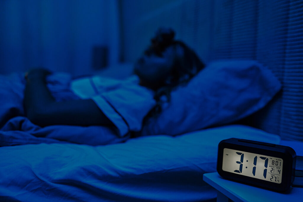 waking up at 3am Person Asleep Near Clock in Blue Bedroom